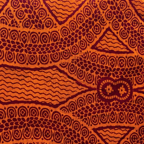 Tissu wax orange cuivré et bordeaux - motifs spirales et triangles