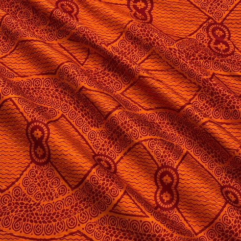 Tissu wax orange cuivré et bordeaux - motifs spirales et triangles