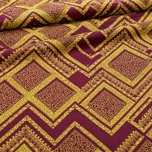 Tissu wax bordeaux et jaune doré à motifs graphiques